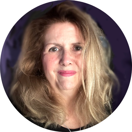Close-up portrait of a smiling woman with shoulder-length blonde hair against a dark purple background.